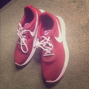 Gently used maroon Nike running shoes
